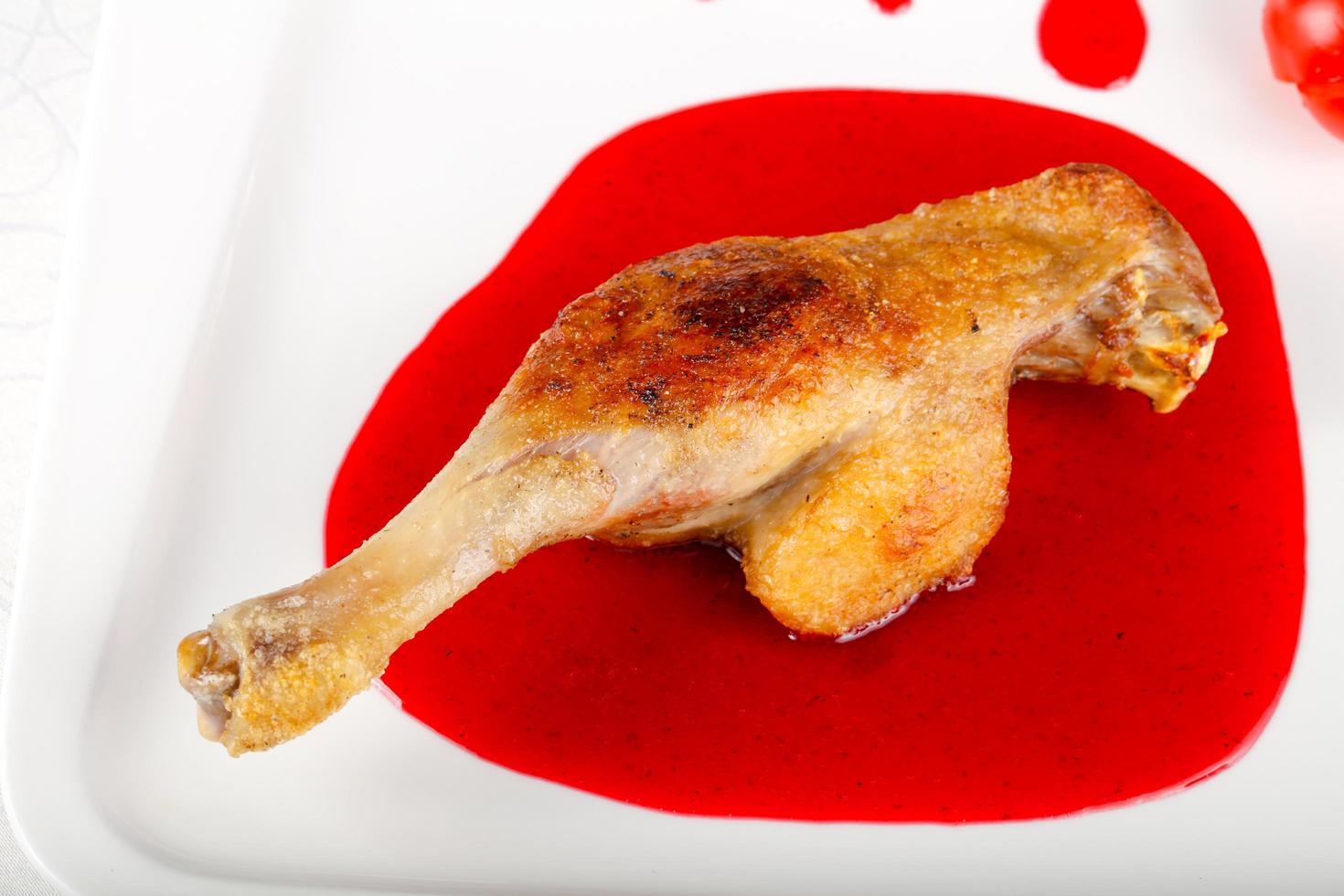 Duck leg on the plate close up view photo
