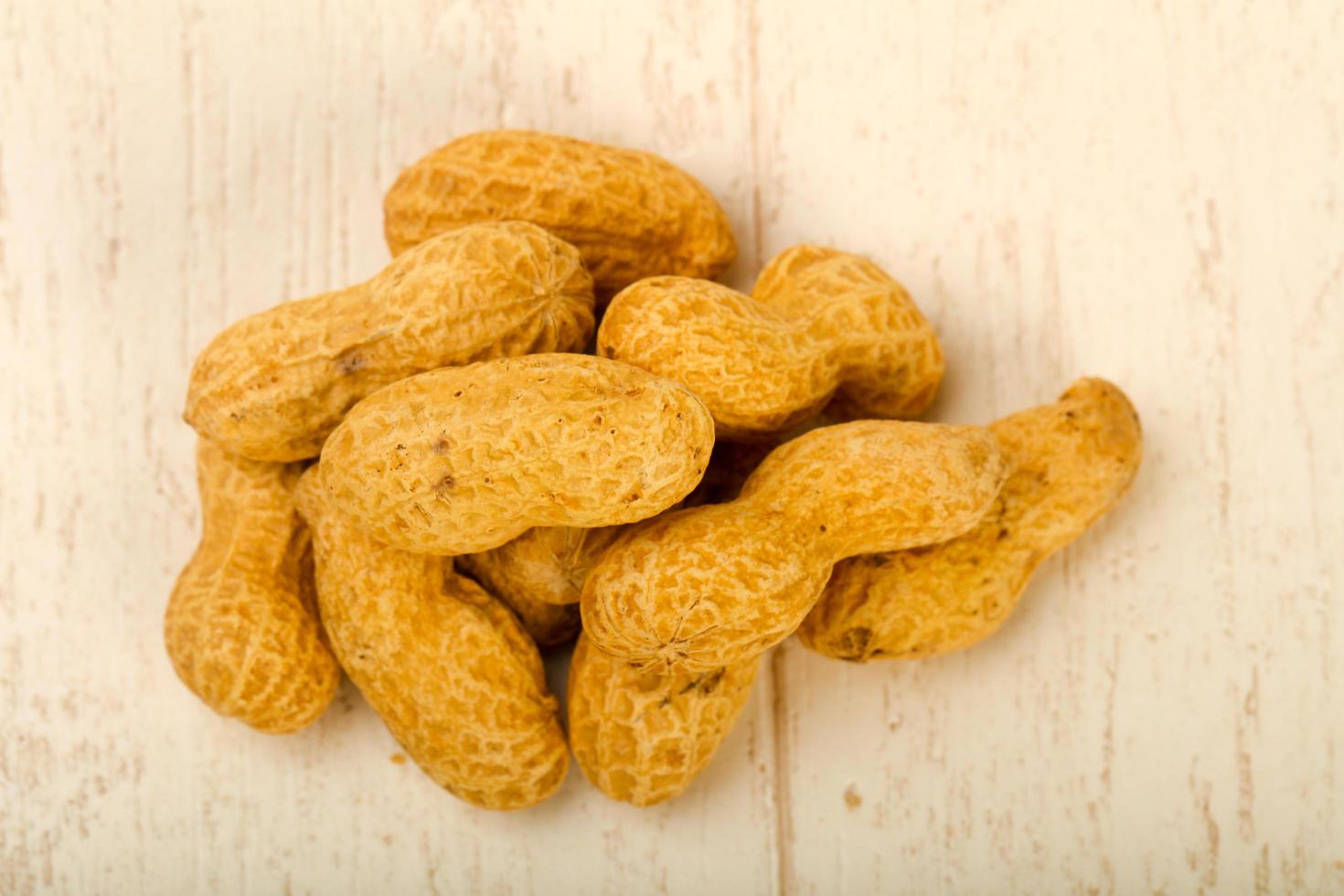 Peanut on wooden background photo