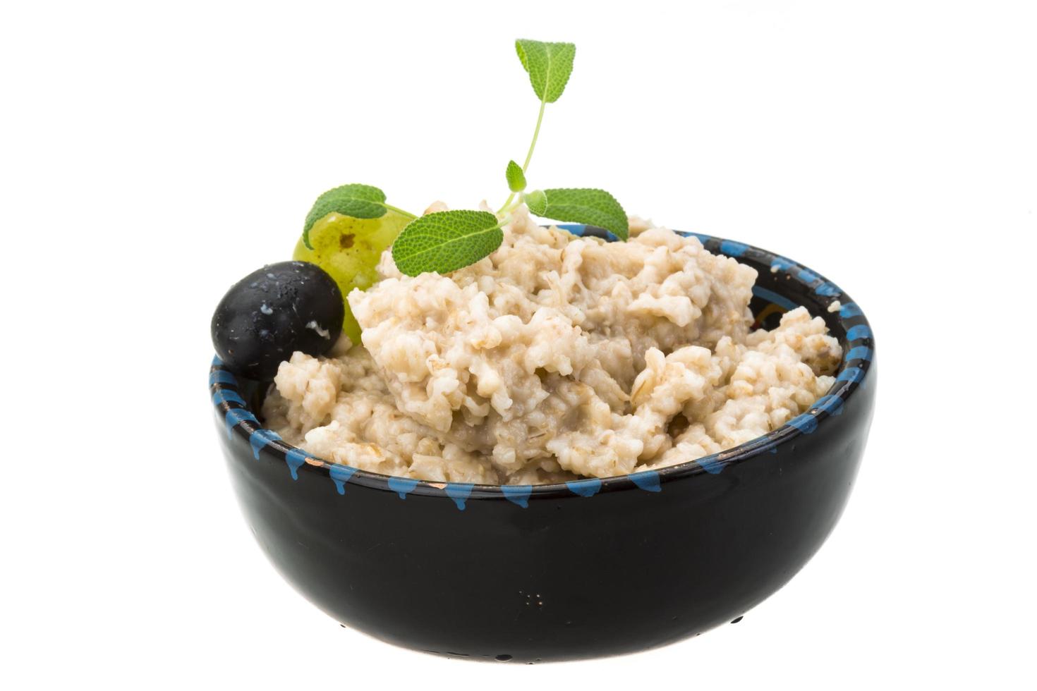 Oats porridge on white photo