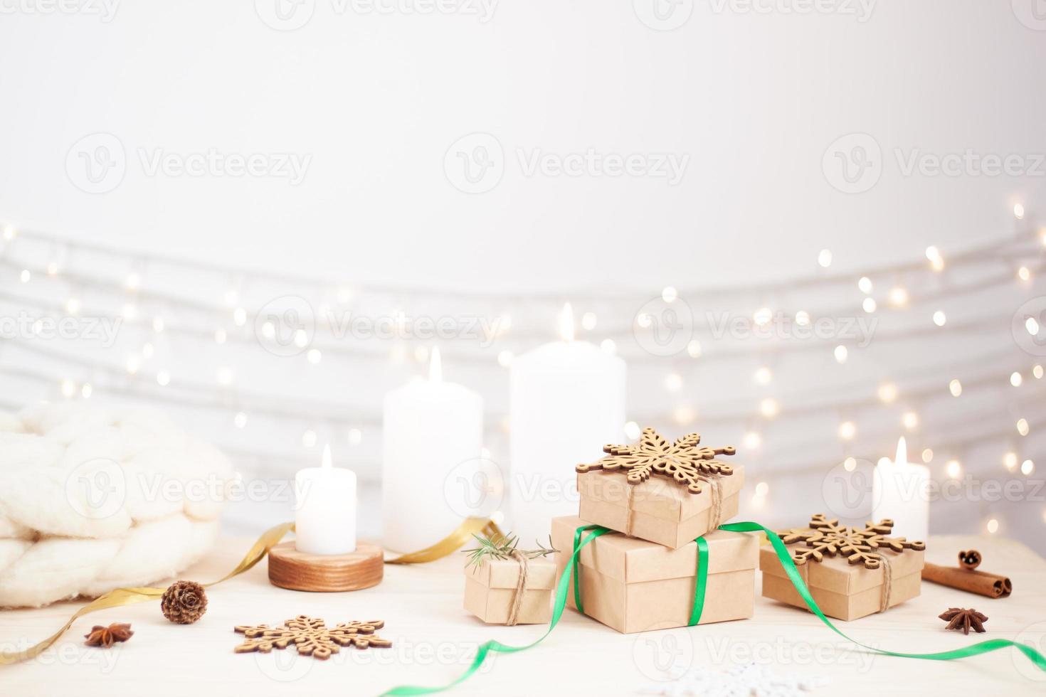 Eco friendly packaging gifts in craft paper on wooden table. Zero waste Christmas holiday concept. Close up, copy space. photo