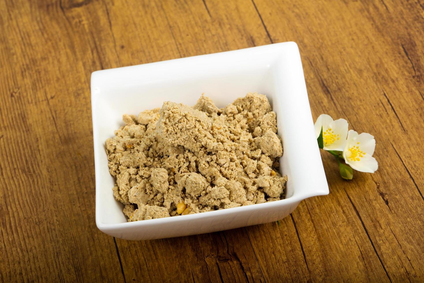 Halva in a bowl on wooden background photo