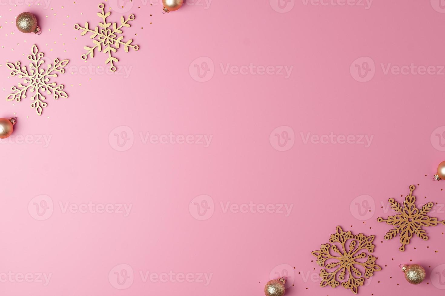 Christmas pink minimal background with snowflakes. Flat lay, copy space photo