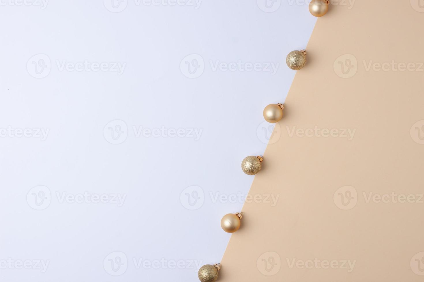 Christmas pastel beige and white minimal background with beige ball. Flat lay, copy space photo