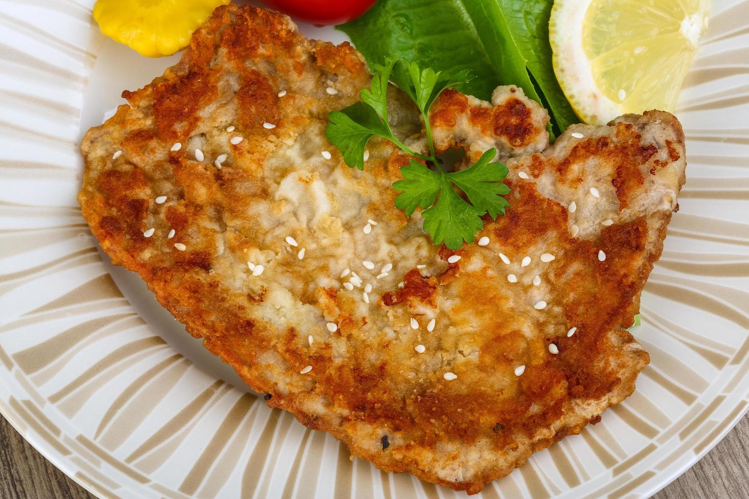 Pork schnitzel dish view photo