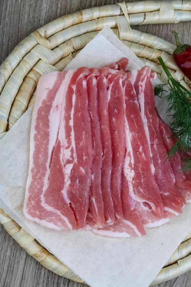 Raw bacon dish view photo