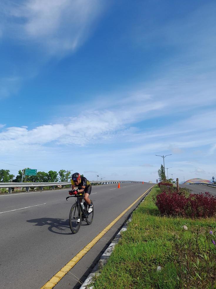 Lombok Island, Indonesia, October 8, 2022, One of the cyclists participating in the Ironman 70.3 triathlon on the island of Lombok, Indonesia photo