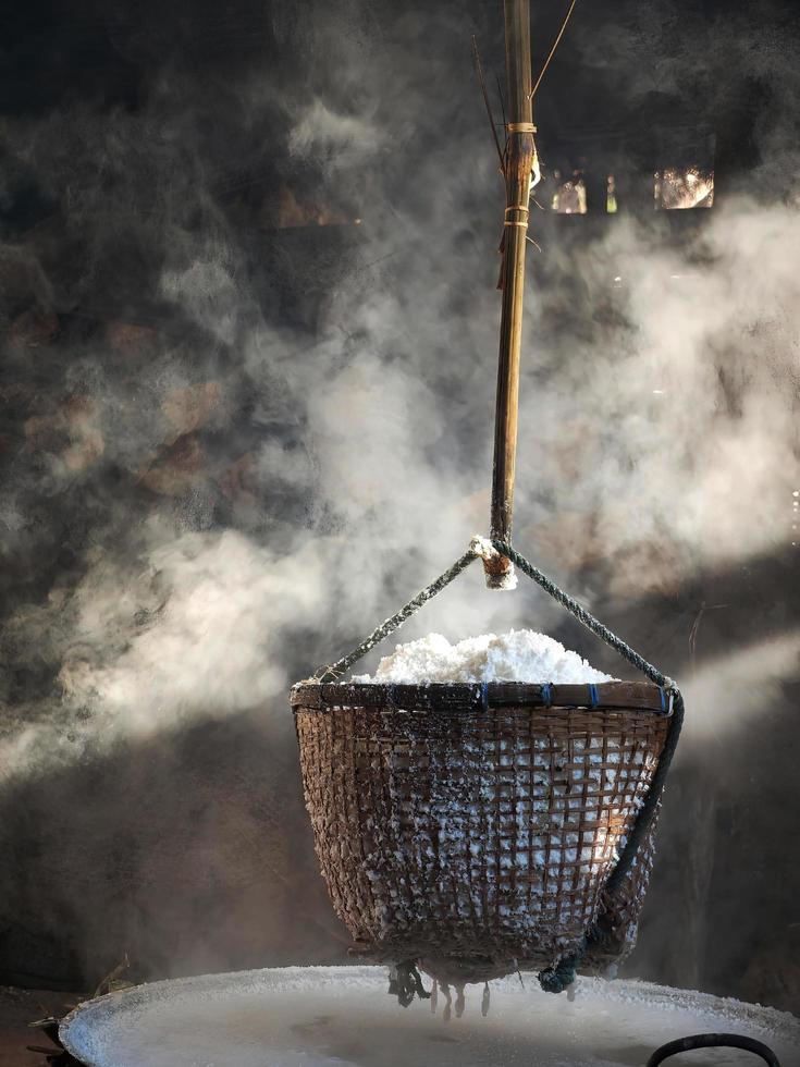 The ancient way of mining rock salt process in the bamboo basket Nan Thailand photo