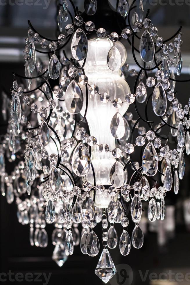 Chrystal chandelier with lights on photo
