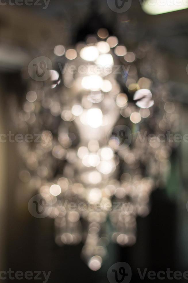 Texture, background. light crystal chandelier with blurred focus photo