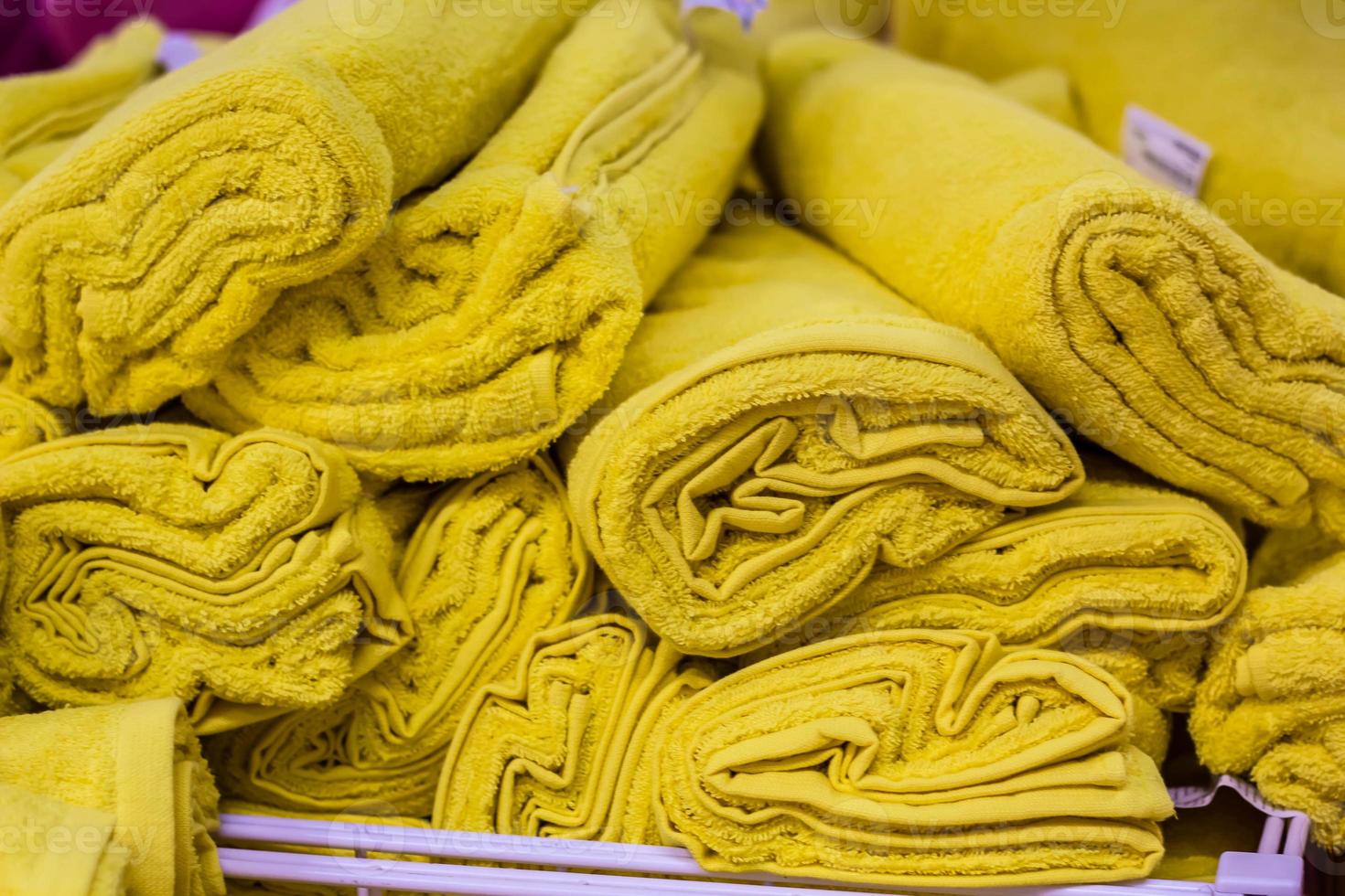 pile of yellow towel arranging in layer photo