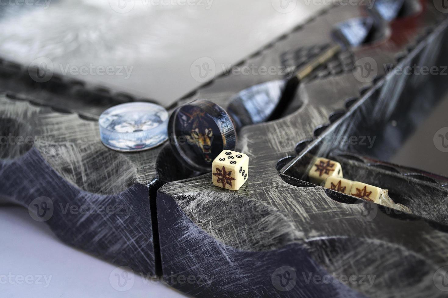 Backgammon. The photo shows backgammon, chips and dice close-up.