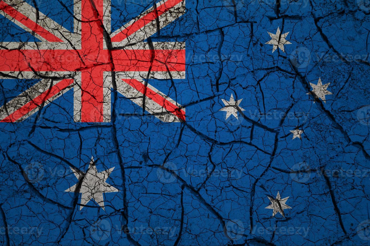 Dry soil pattern on the flag of Australia. Country with drought concept. Water problem. Dry cracked earth country. photo