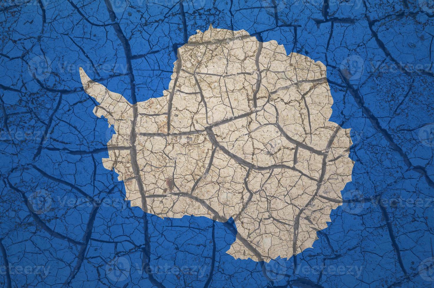Dry soil pattern on the flag of Antarctica. Country with drought concept. Water problem. Dry cracked earth. photo