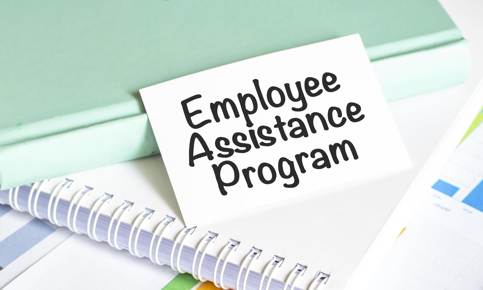 EAP Employee Assistance Program text and notepads with charts 12847433