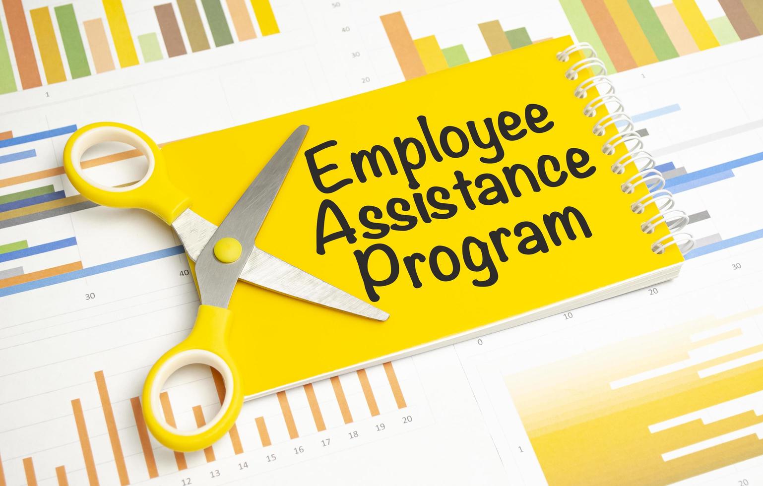 EAP Employee Assistance Program on yellow notebook and charts 12847437 ...