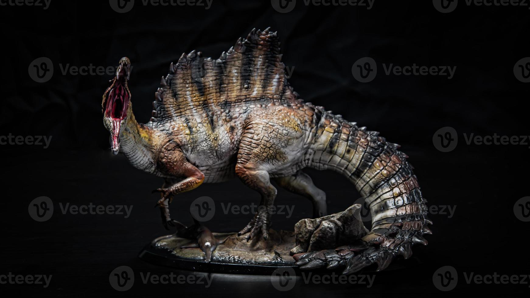 dinosaur , spinosaurus in the dark photo