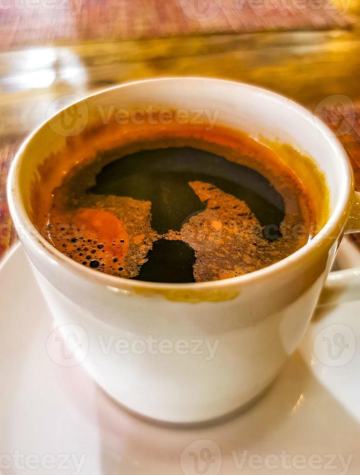 Cup of americano black coffee in restaurant Mexico. photo