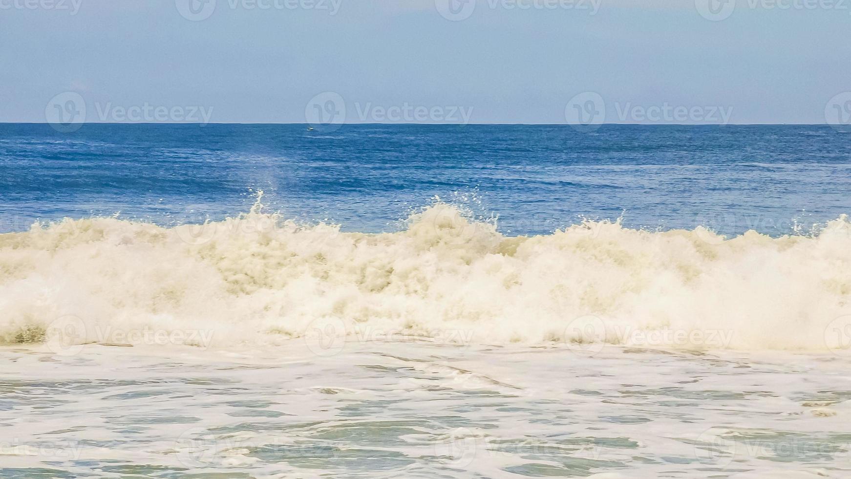 Extremely huge big surfer waves at beach Puerto Escondido Mexico. photo