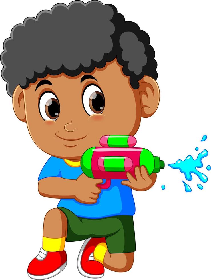 niño jugando con pistola de agua vector