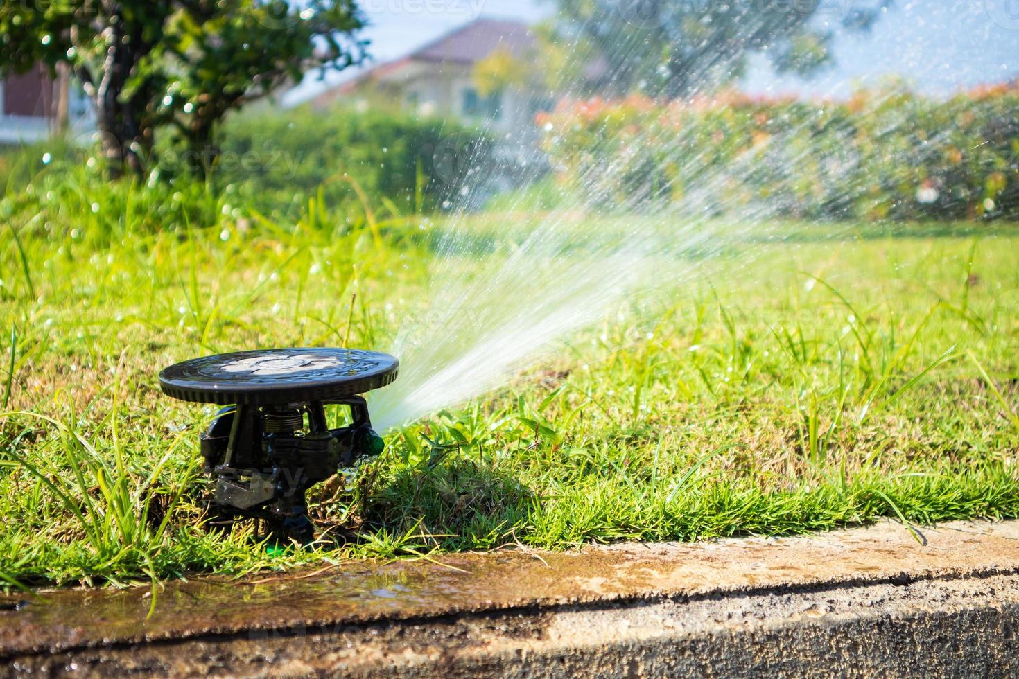 Automatic lawn sprinkler watering grass garden irrigation system photo