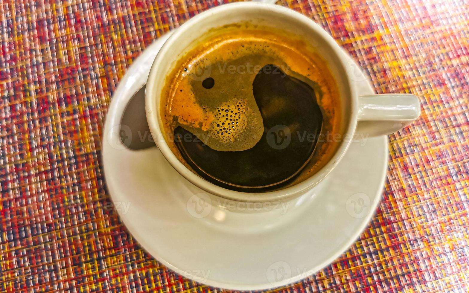 Cup of americano black coffee in restaurant Mexico. photo