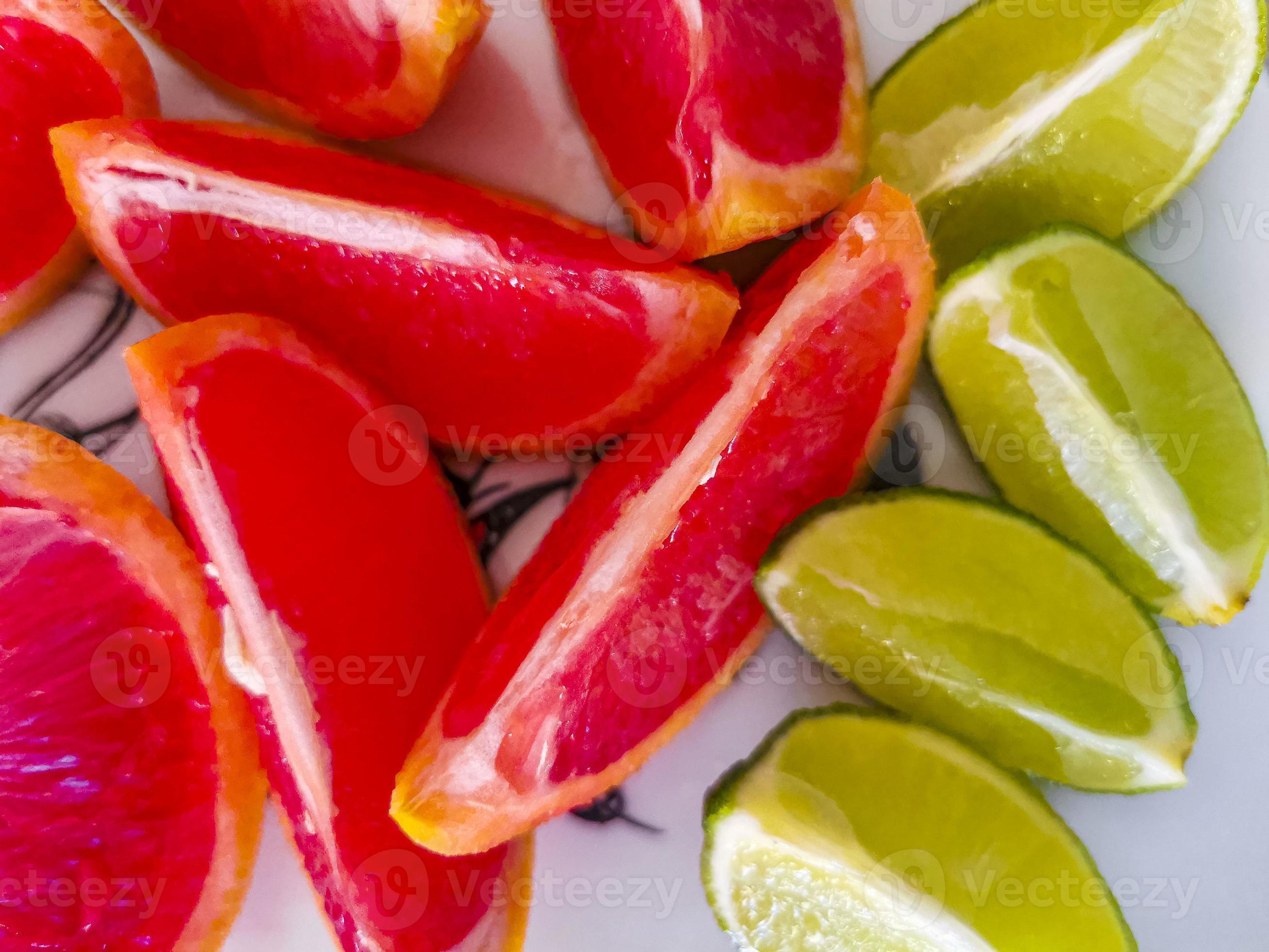 Grapefruits limes grapes lemon citrus fruits on plate Mexico. 12853323