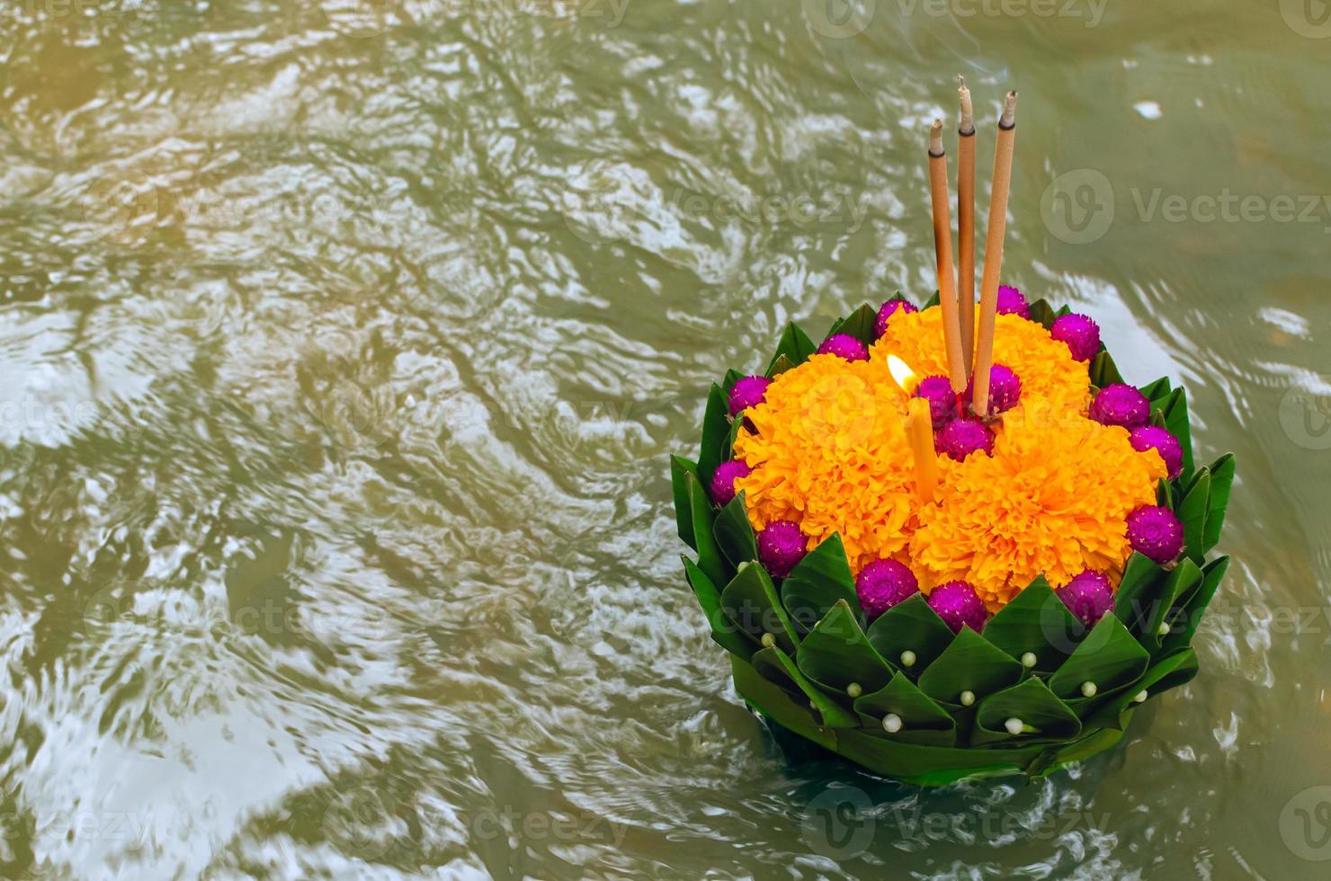 Banana leaf Krathong floating on river for Thailand full moon or Loy Krathong festival. photo