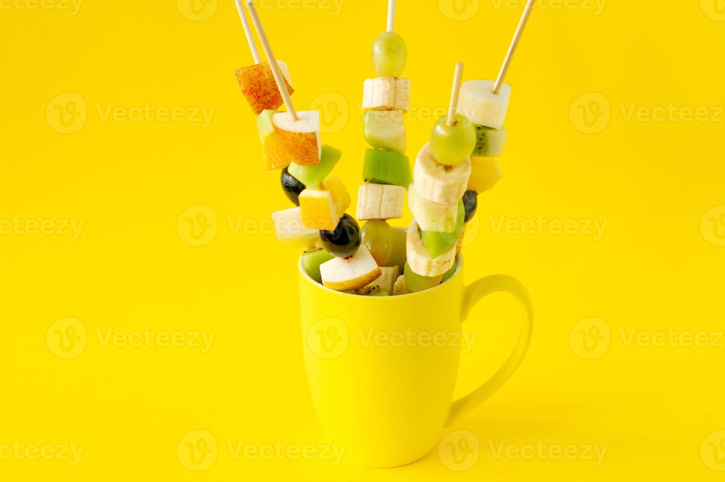 Fruit canape for a buffet in a cup. Sweet treats for a holiday, anniversary, birthday. photo