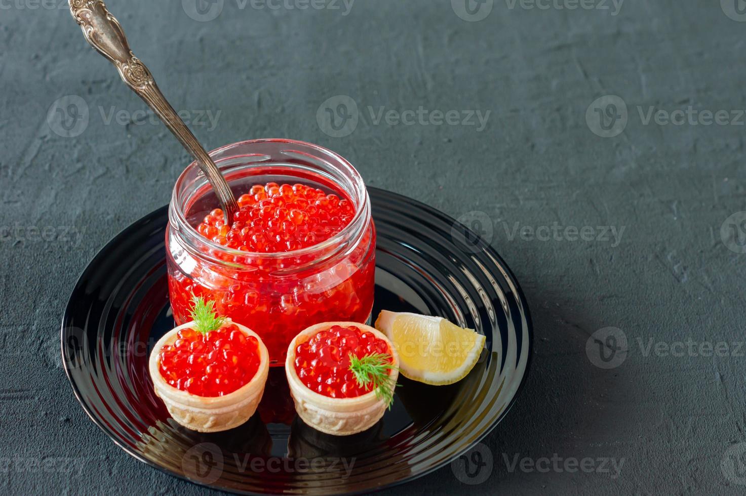 Tartlets with butter and red caviar. Gourmet food, appetizer. Delicatessen. Seafood. photo