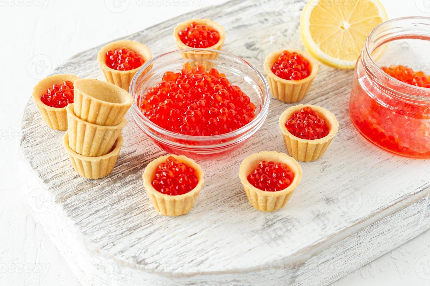 Tartlets with butter and red caviar. Gourmet food, appetizer. Delicatessen. Seafood. photo