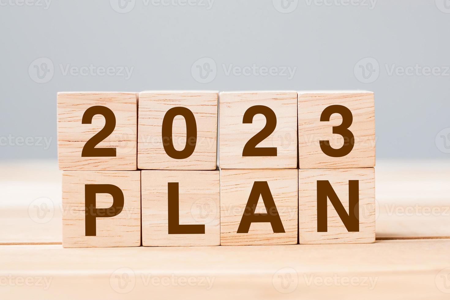 block 2023 PLAN text on table. Resolution, strategy, goal, motivation, reboot, business and New Year holiday concepts photo