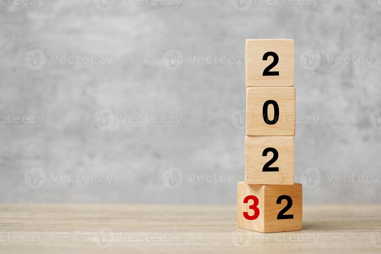 block flipping 2022 to 2023 text on table. Resolution, strategy, plan, goal, motivation, reboot, business and New Year holiday concepts photo