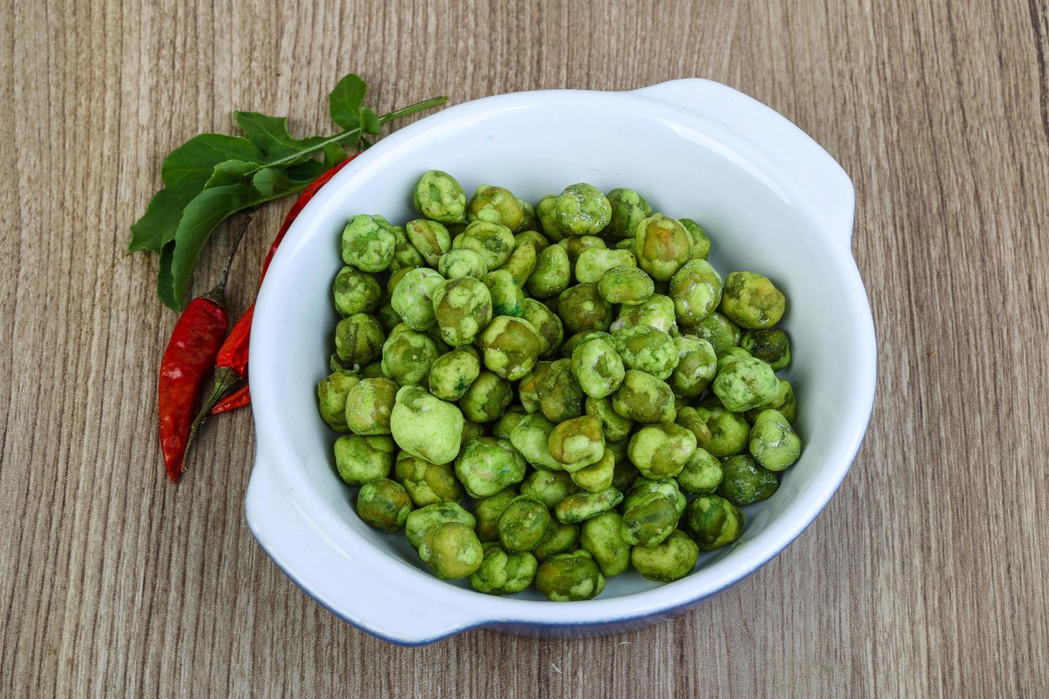 Wasabi peas on wood photo