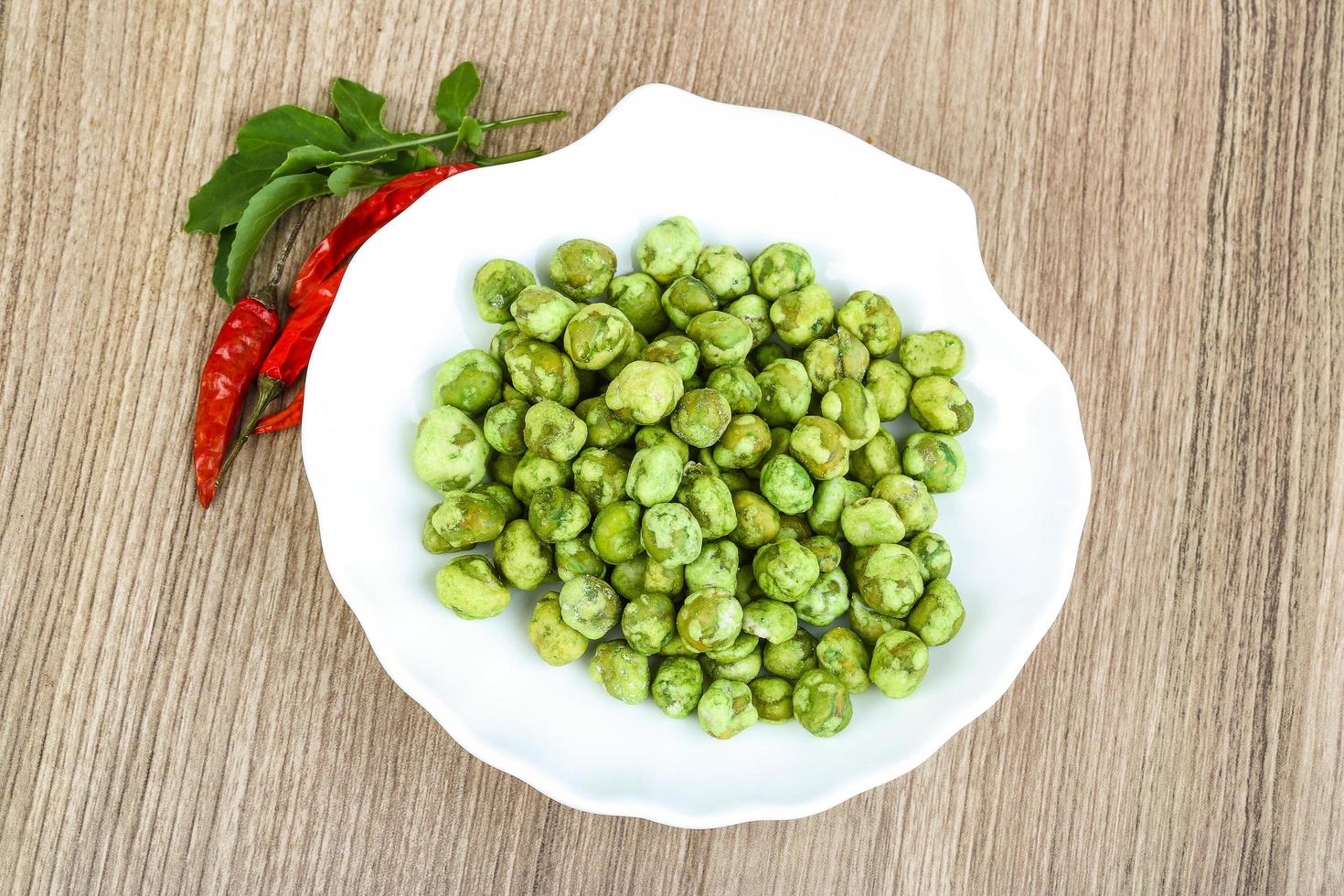 Wasabi peas on wood photo