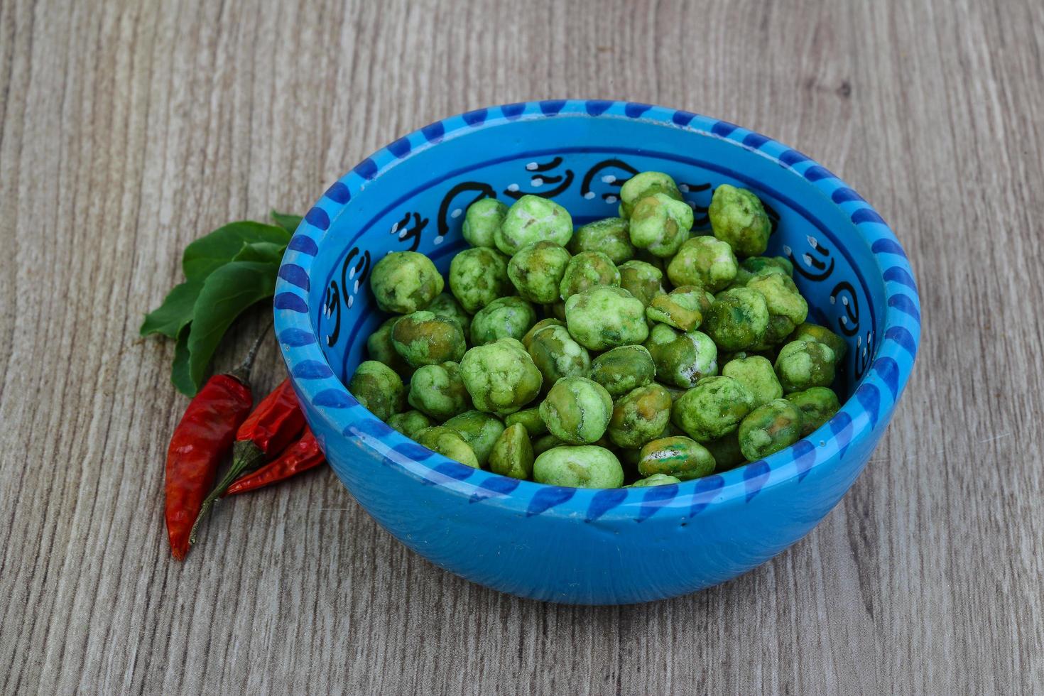 Wasabi peas on wood photo