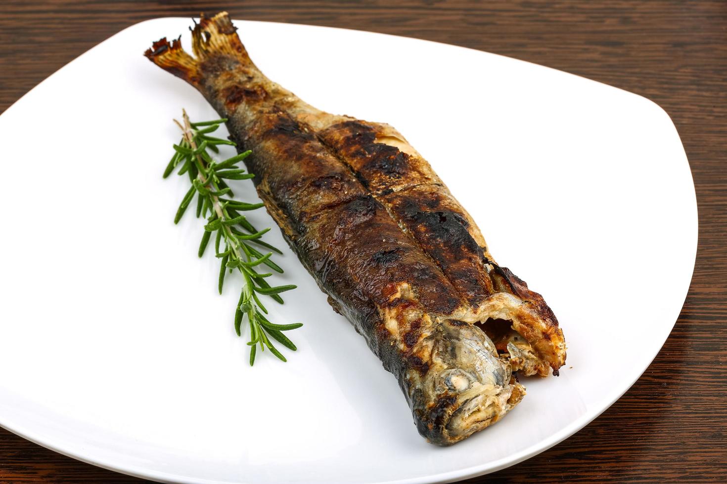 Grilled trout on wood photo