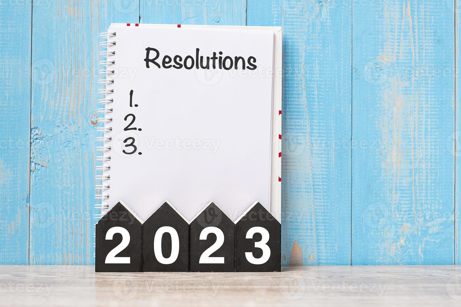 2023 Happy New Year with RESOLUTION word and wooden number. time for a New Start, goal, Plan, Action and Mission Concept photo