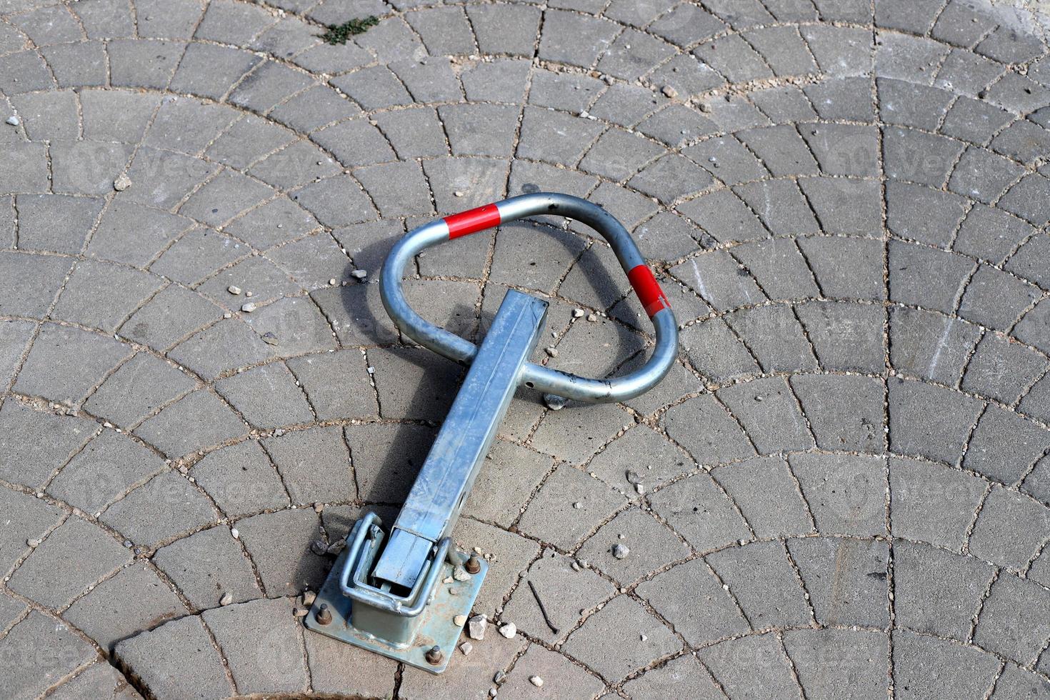 Road barriers along the sidewalk for the safe passage of pedestrians. photo