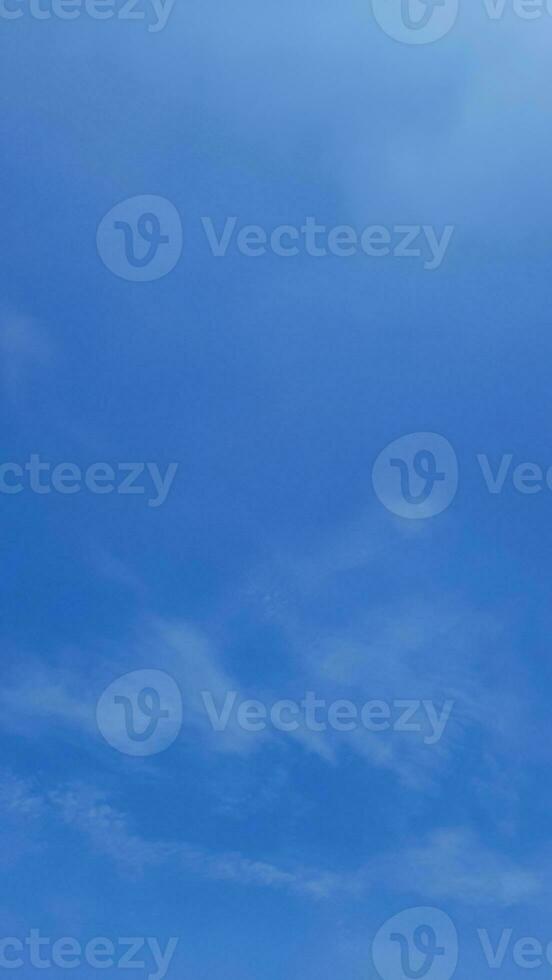 Blue sky background with thin clouds in Indonesian sky photo