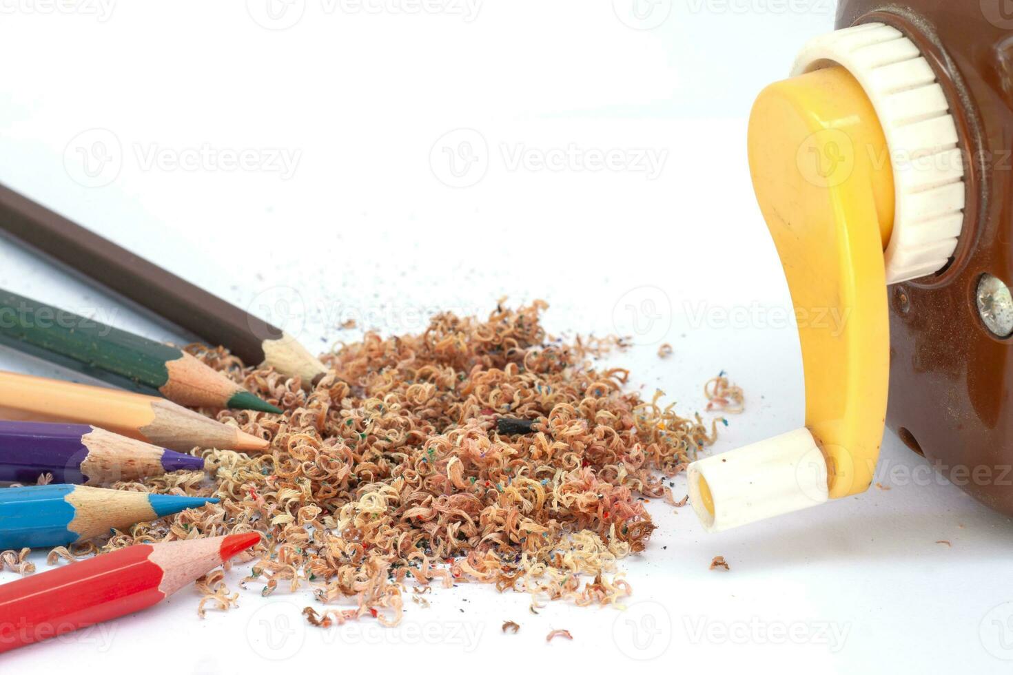 Wood color shavings isolated on white paper background. photo