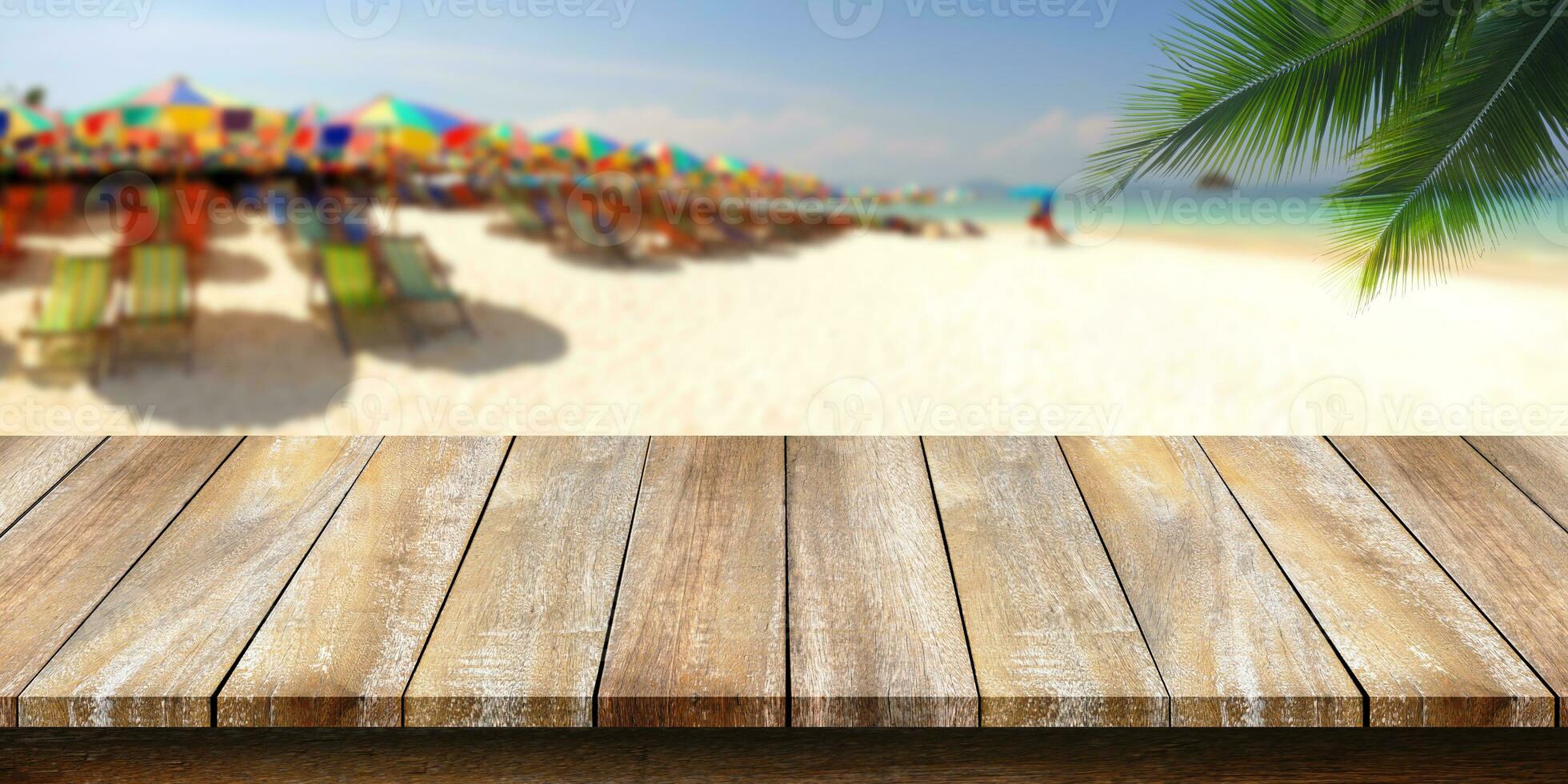 Empty of wooden table top with a coconut leaf background and blurred beach. For montage product display or design key visual layouts. photo