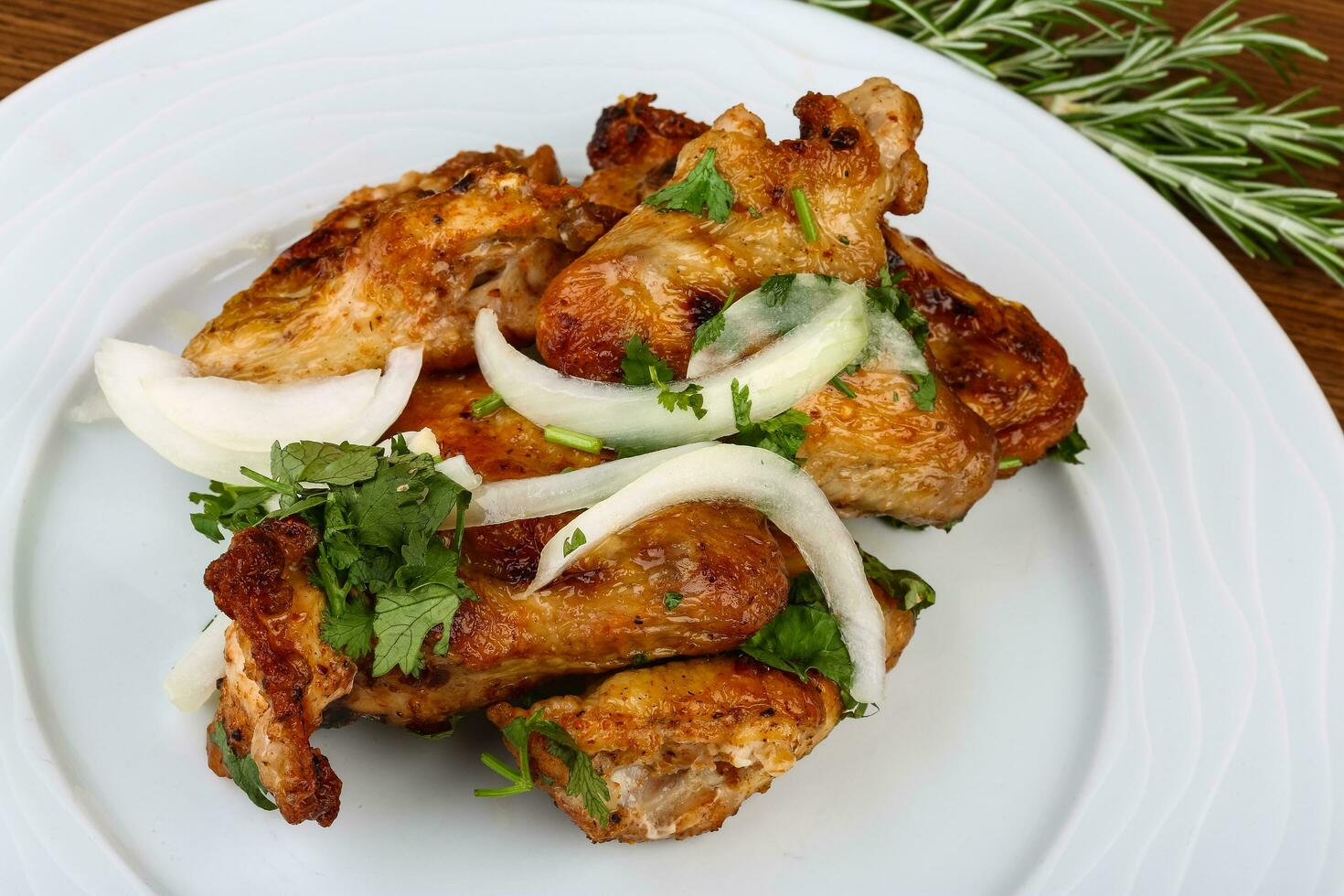 Chicken wings on the plate and wooden background 12861255 Stock Photo