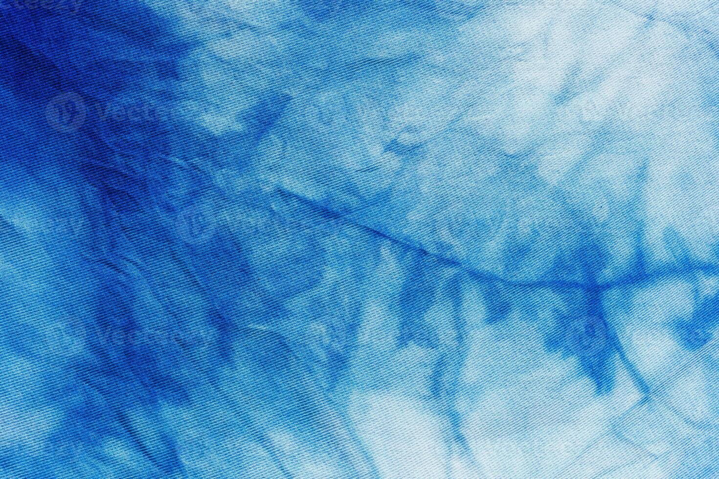 handcrafted tie dye blue abstract pattern on silk photo