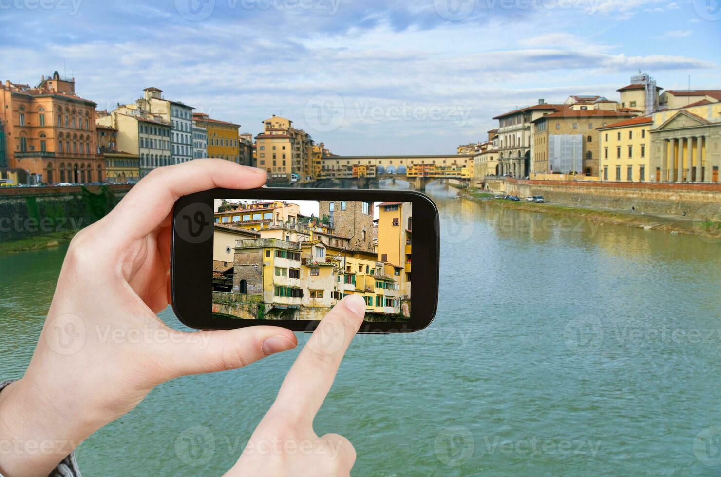 tourist taking photo Ponte Vecchio on Arno River