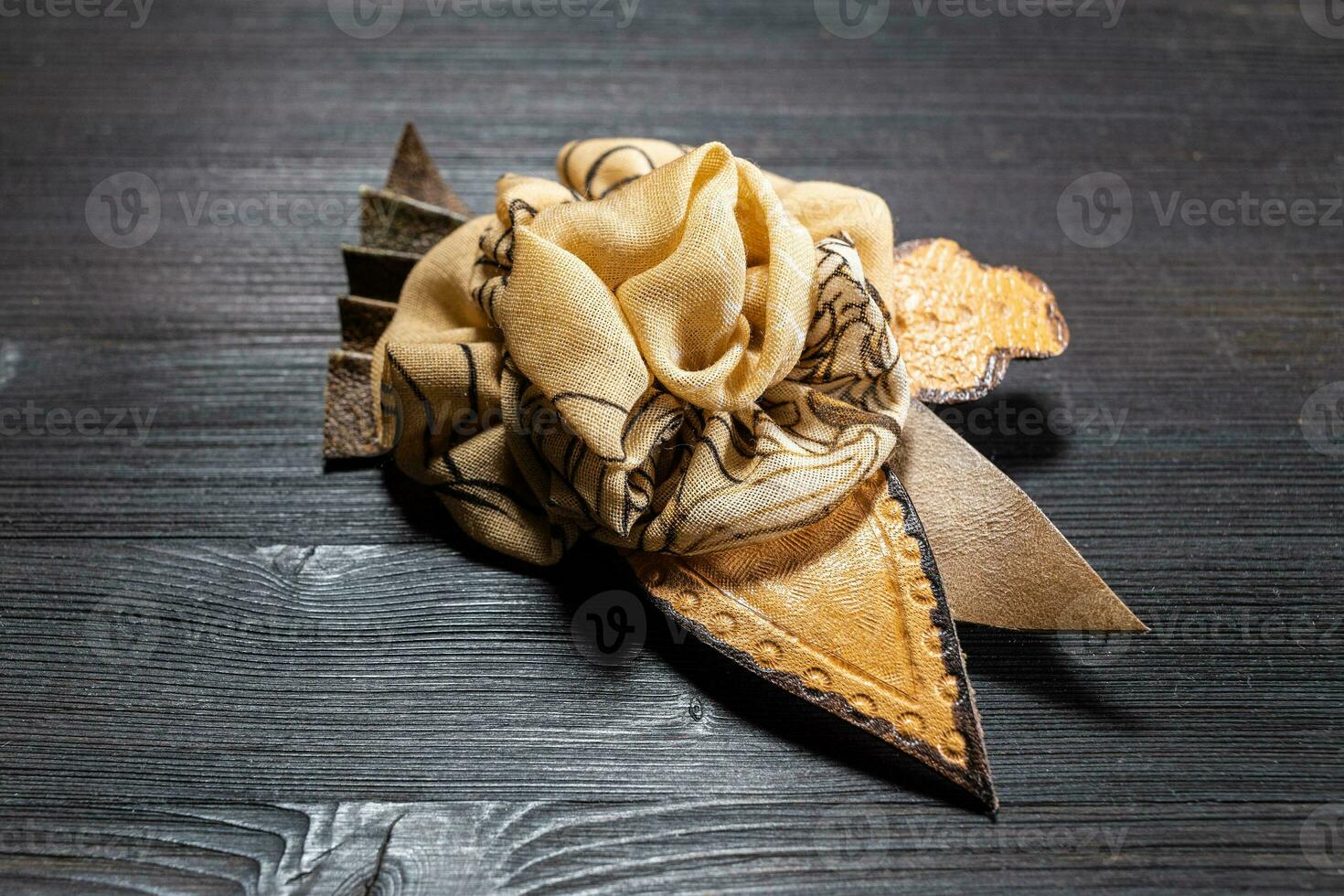 brown leather and silk brooch stylized as flower photo