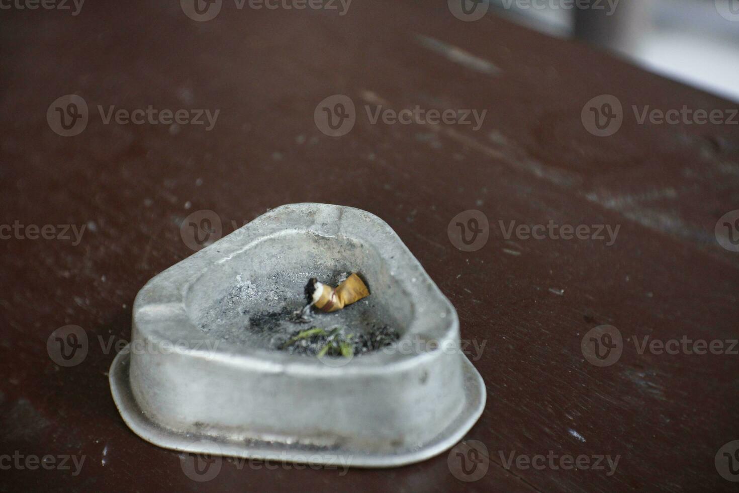 negative space with the main object being an ashtray for health quotes or cigarette photo