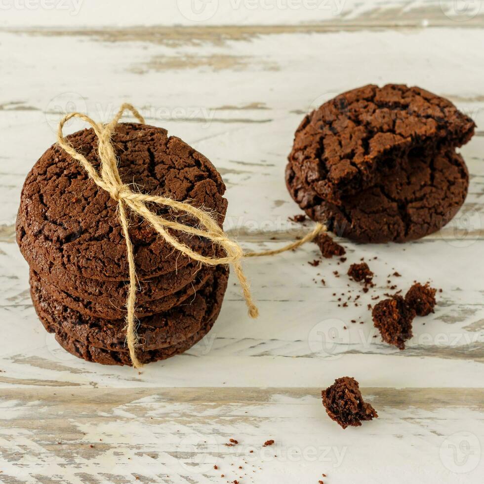 stuck of chocolate brownie cookies on wooden background. Homemade fresh pastry. photo