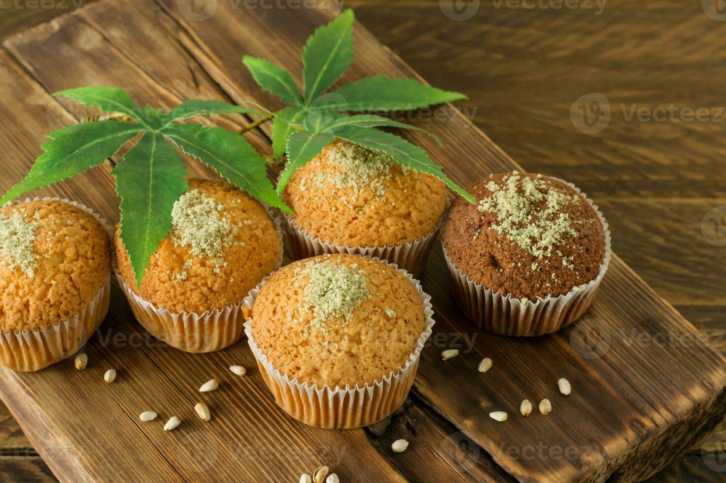 Cupcake with marijuana. Tasty cupcake muffins with cannabis weed cbd. Medical marijuana drugs in food dessert, ganja legalization. photo