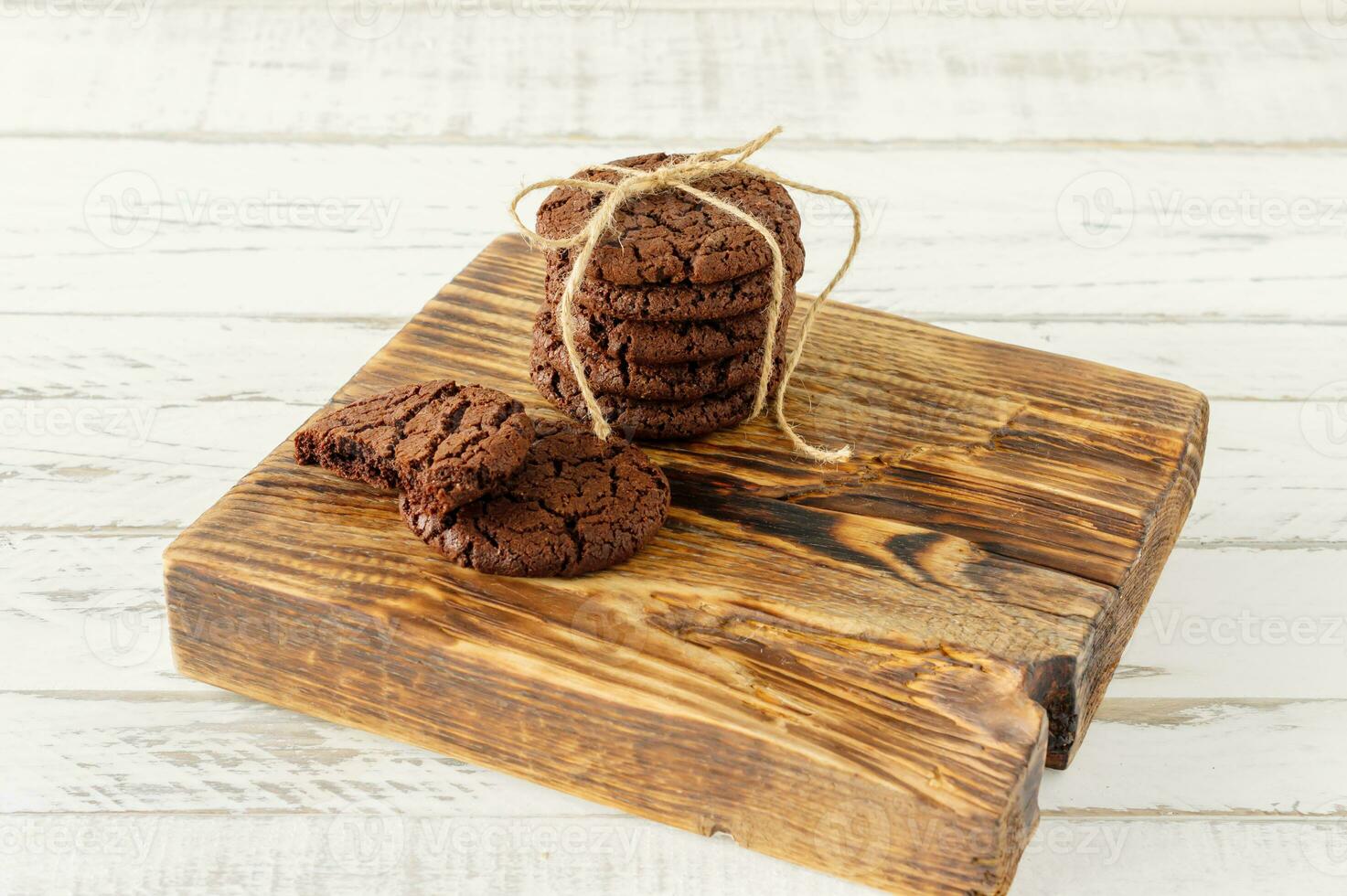 stuck of chocolate brownie cookies on wooden background. Homemade fresh pastry. photo