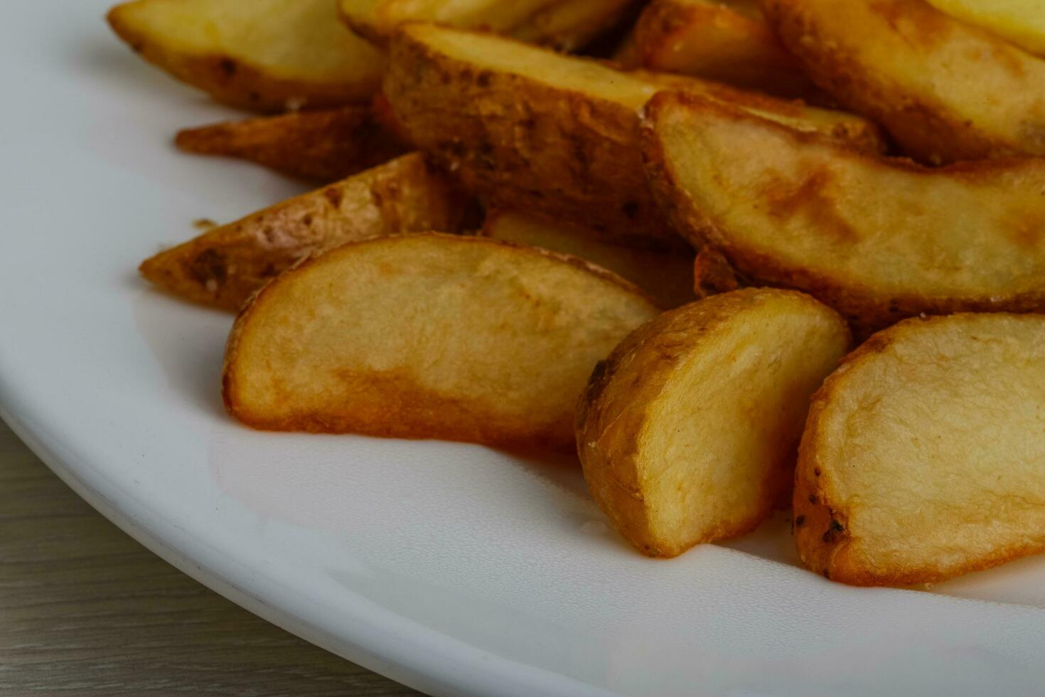 Fried potato on the plate photo